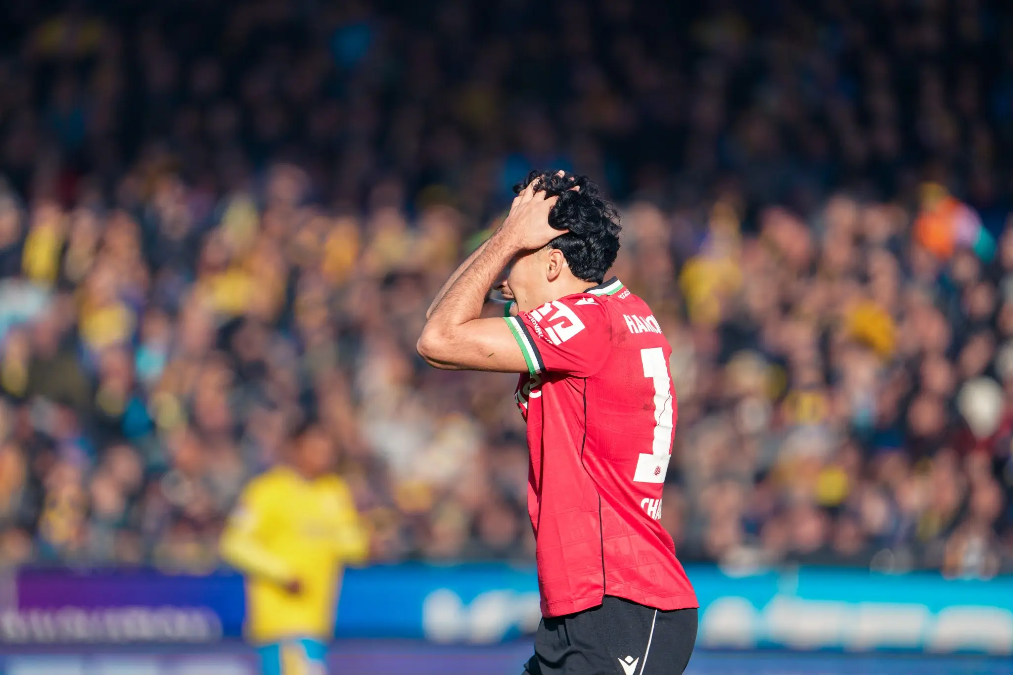 A Hannover 96 player reacts with disappointment during the defeat in Braunschweig.