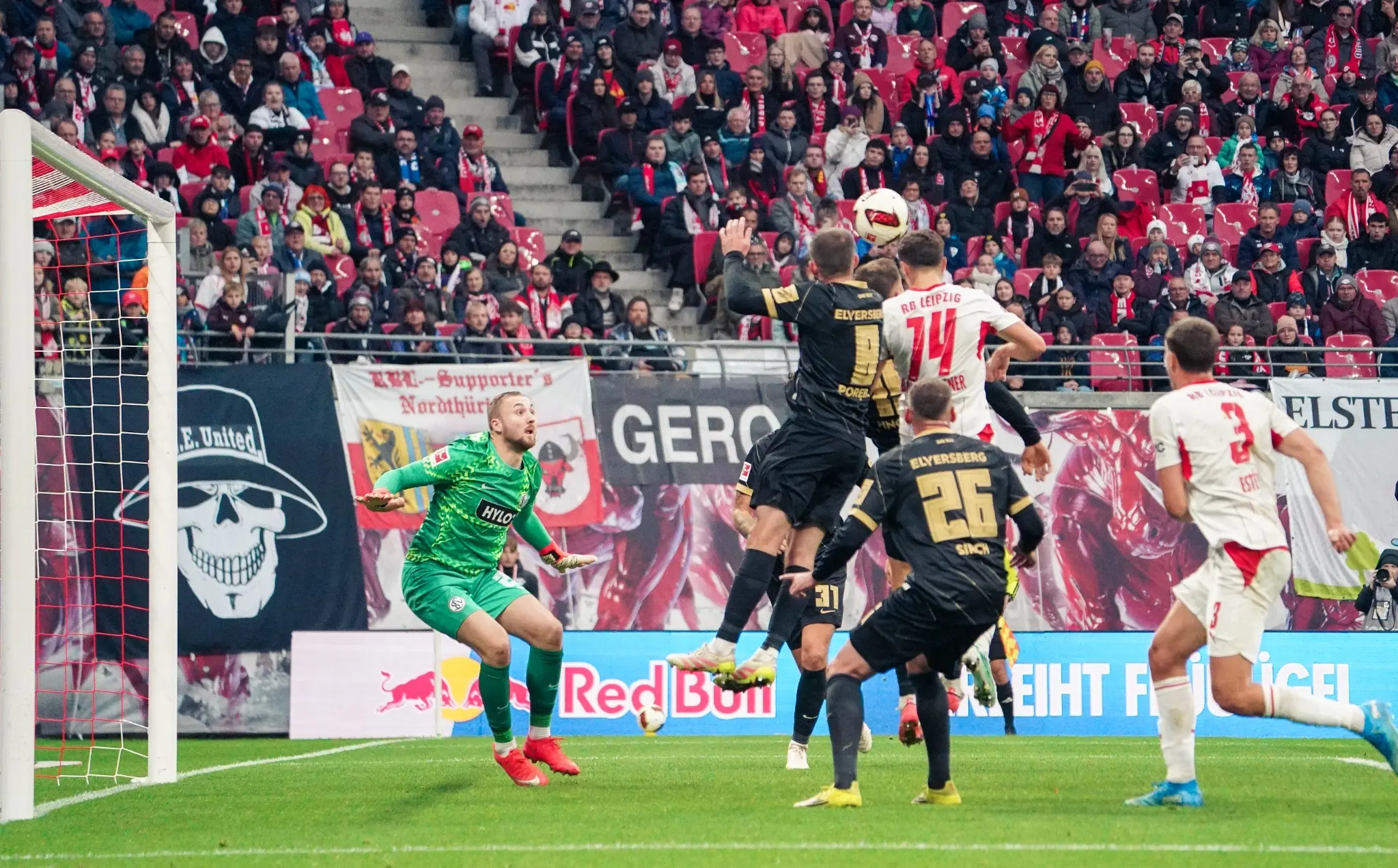RB Leipzig attack an aerial ball in the SV Elversberg penalty area.