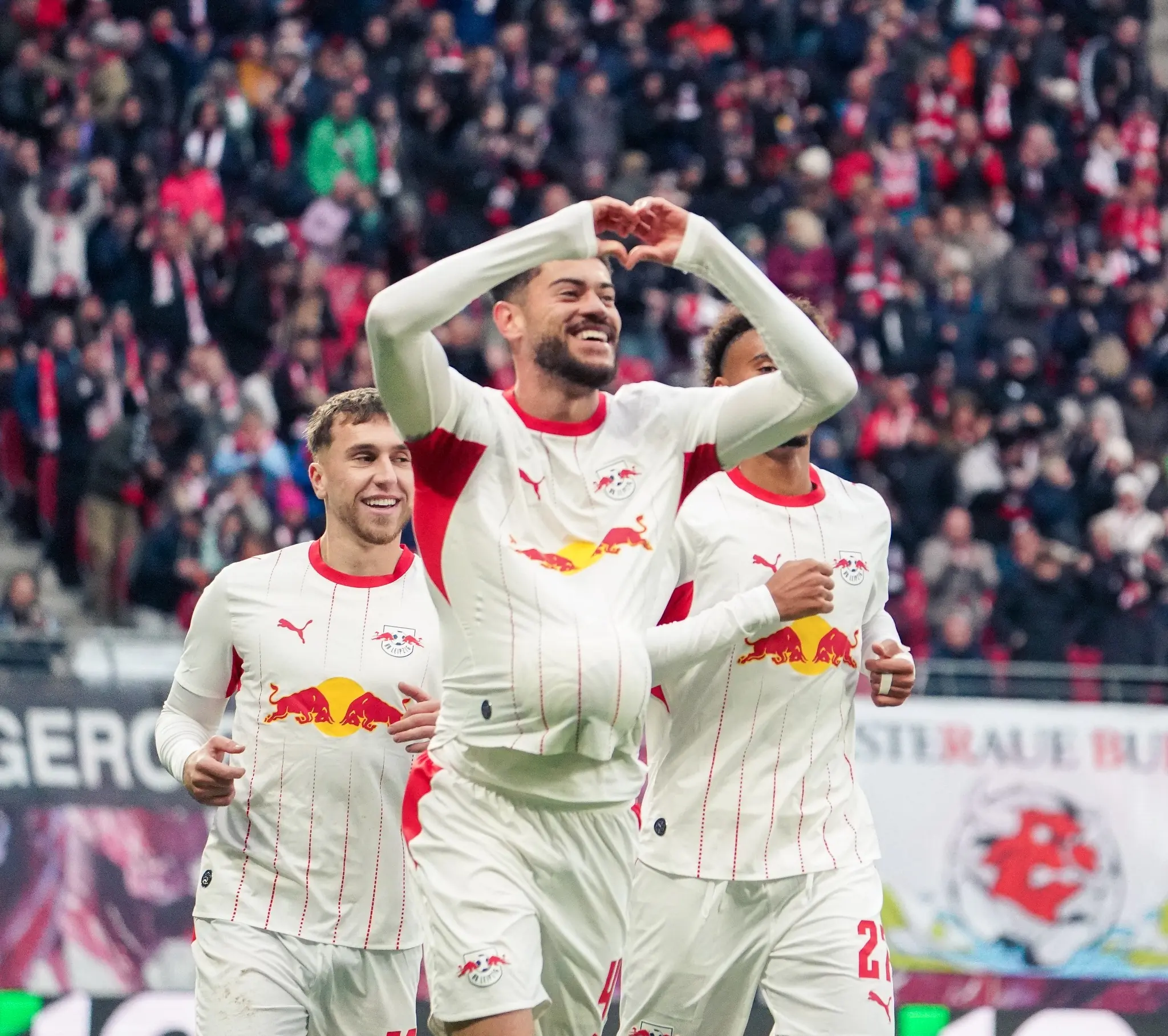 An RB Leipzig player makes a heart gesture during the 4:0 home victory.