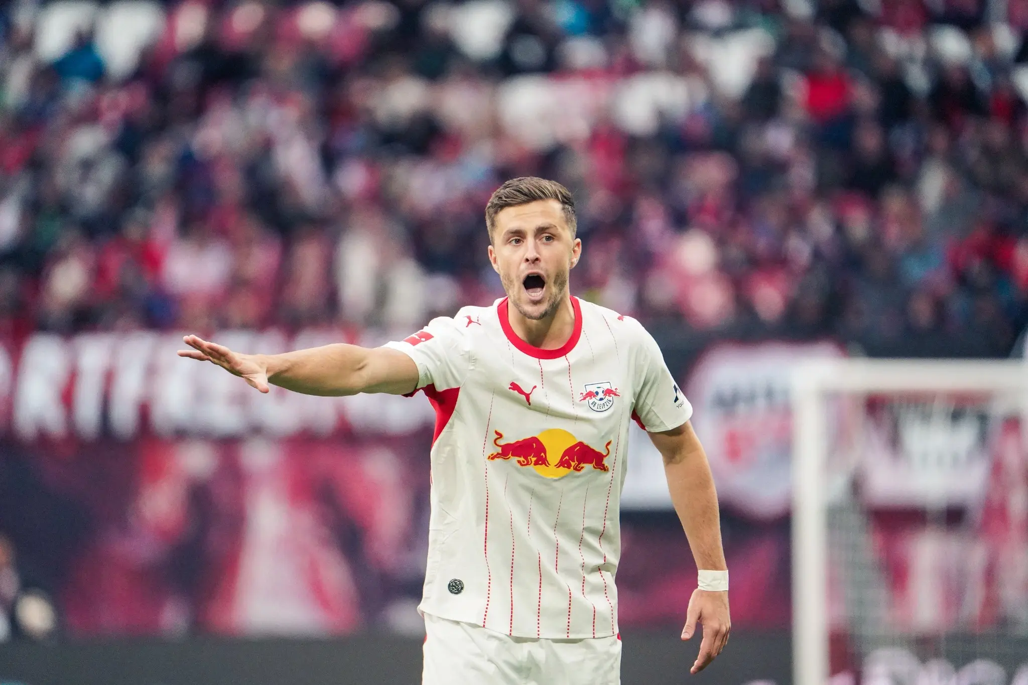 An RB Leipzig player directs teammates during the Bundesliga victory over SV Elversberg.