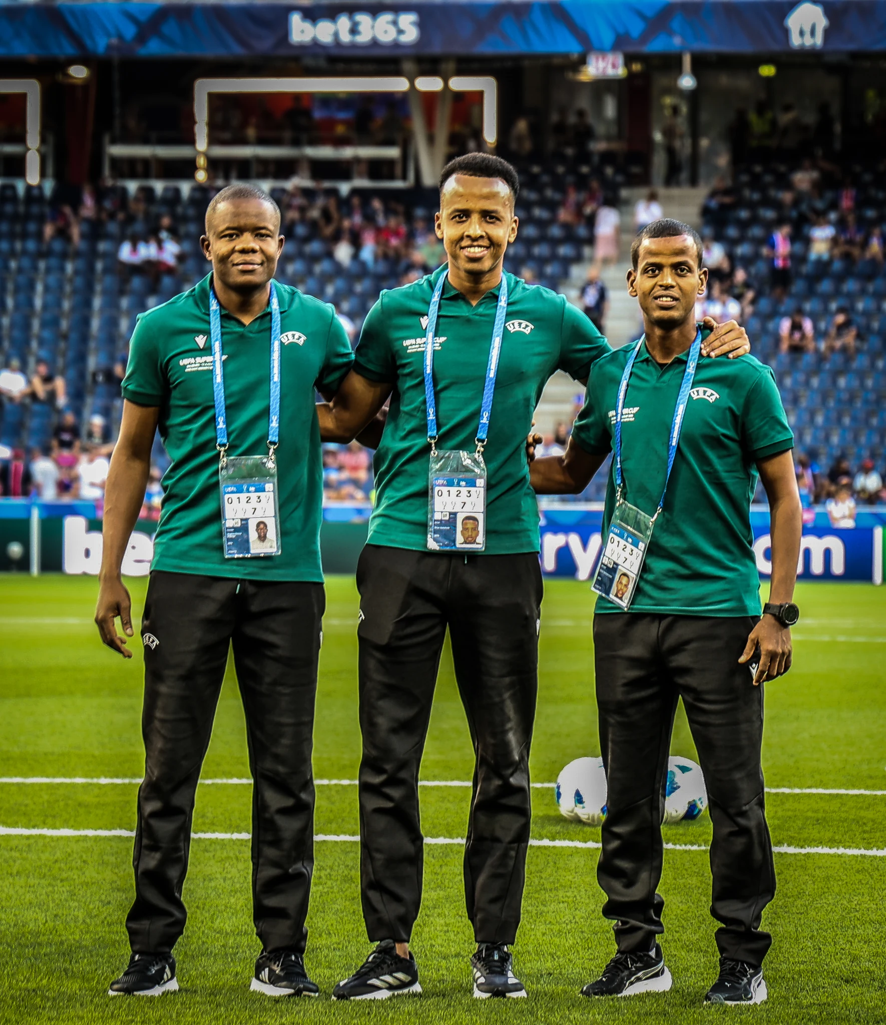 Photographers pose together beside the pitch before the Super Cup.