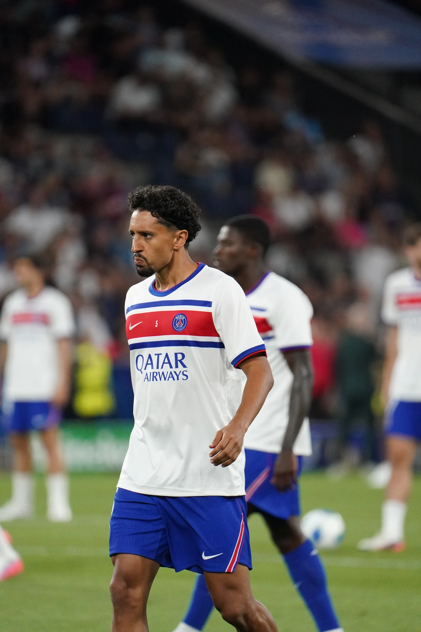 Paris Saint-Germain players prepare on the pitch in Salzburg.