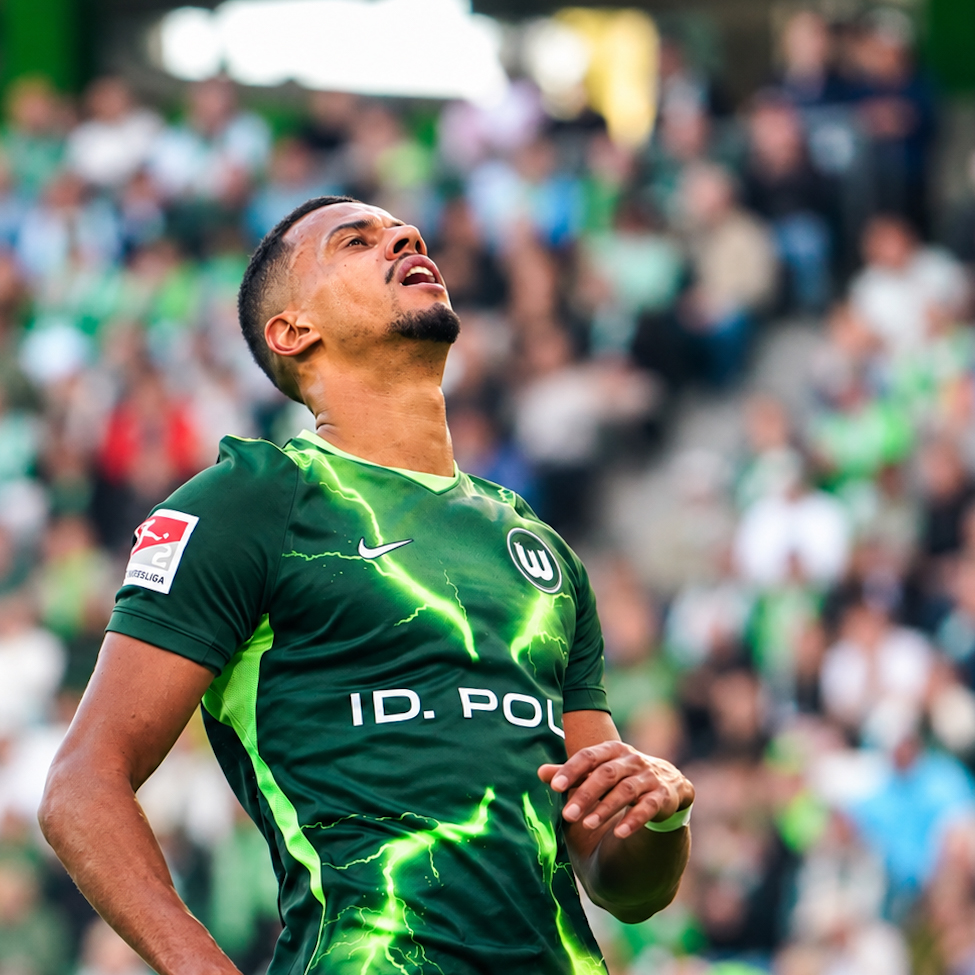A VfL Wolfsburg player reacts during the match against Energie Cottbus.