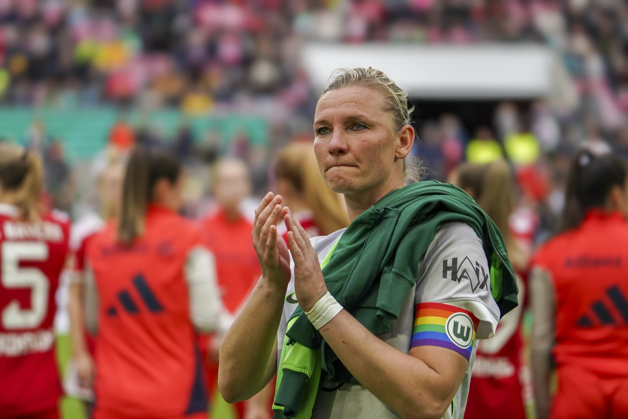 A Wolfsburg player applauds the supporters after the final.