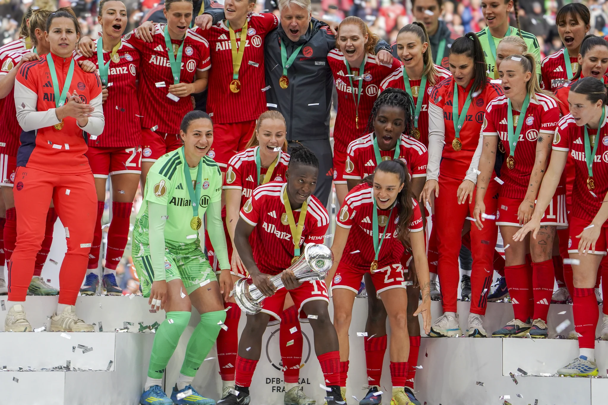 Bayern Munich celebrate with the cup and confetti in Cologne.
