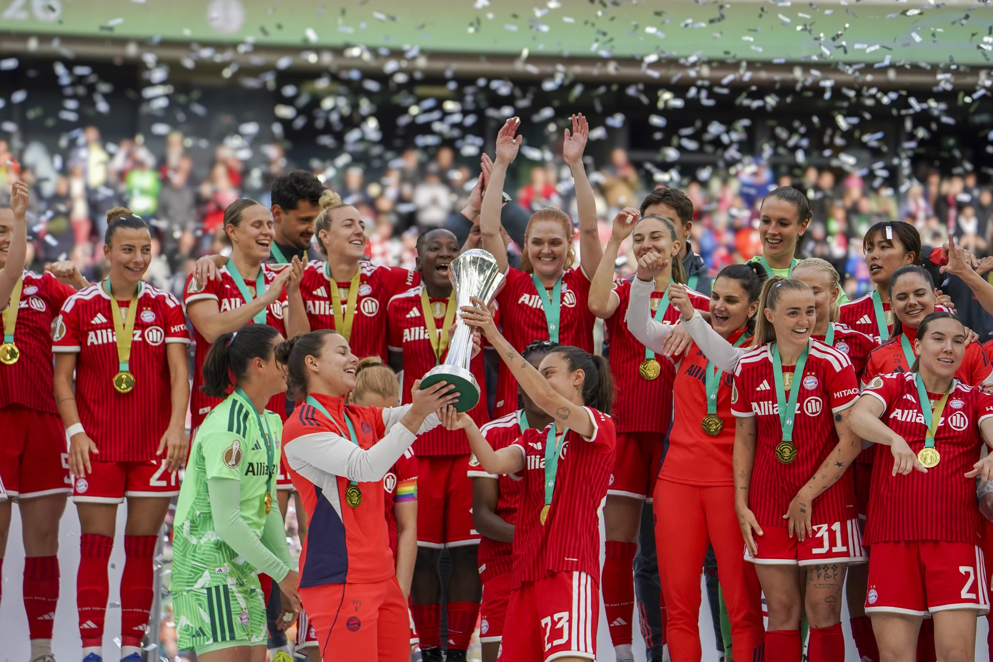 Bayern Munich celebrate with the cup and confetti in Cologne.